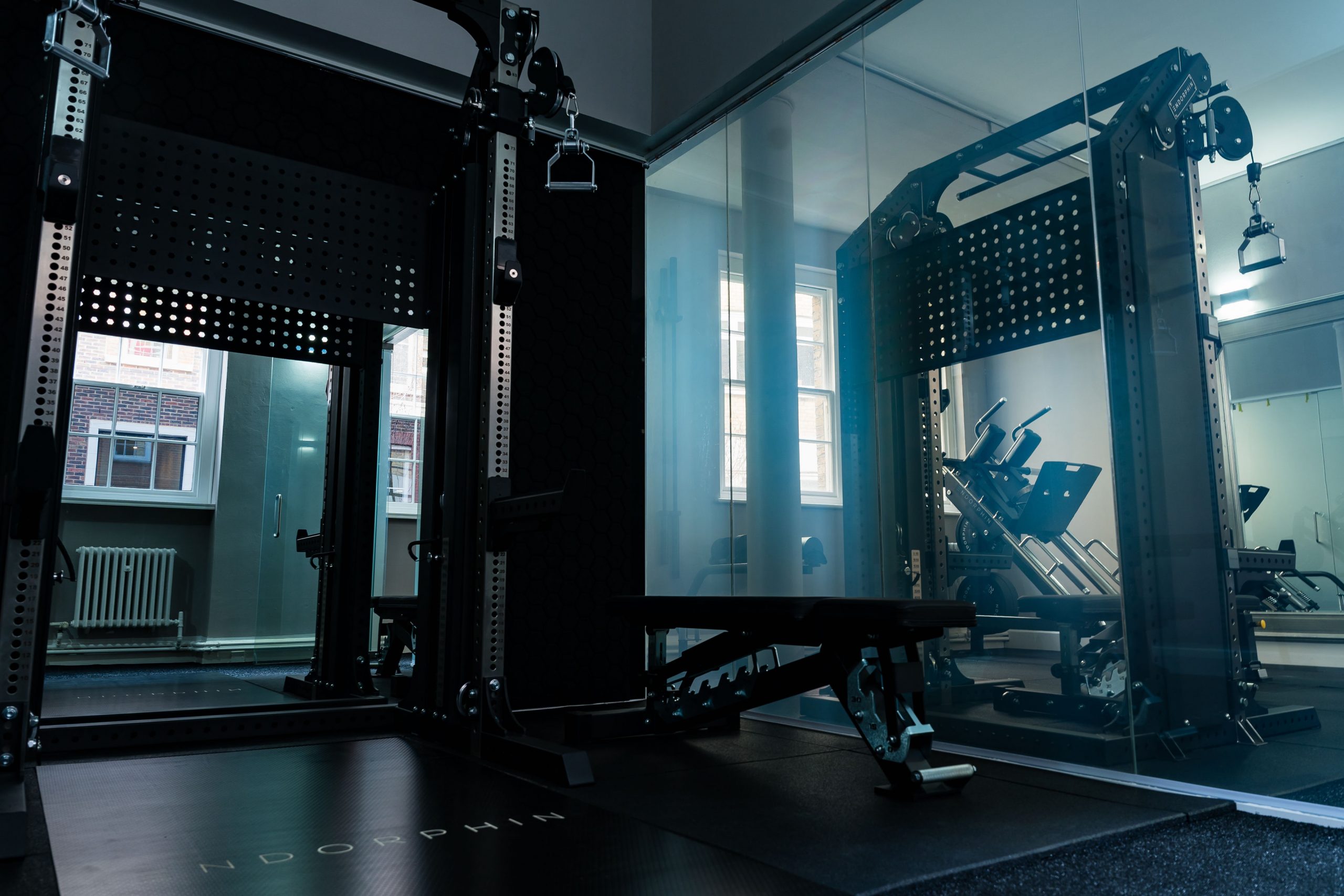 Decorative image showing inside the Endorphin London personal training facility, with various workout equipment visible.